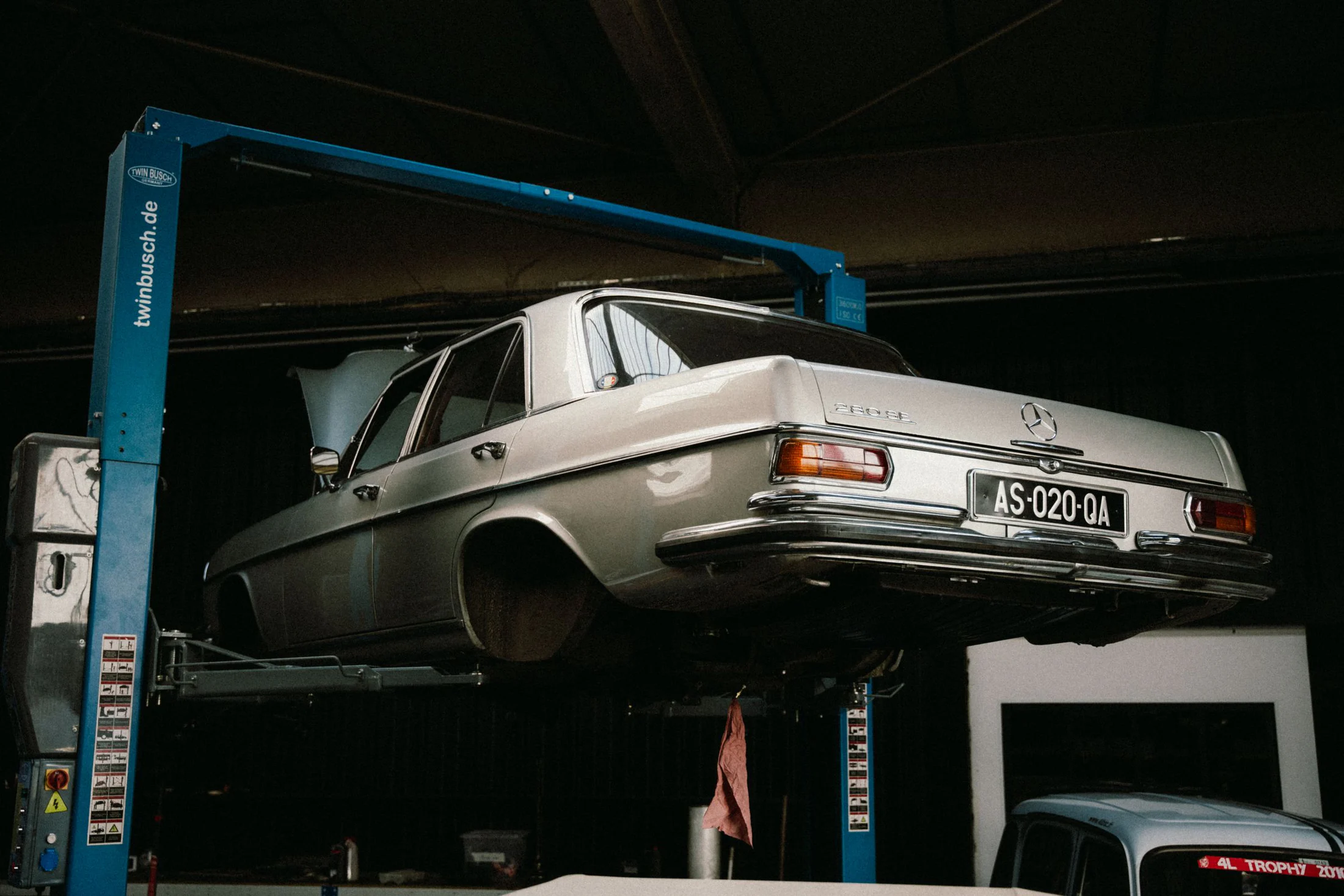 Classic Mercedes-Benz elevated in a specialist workshop